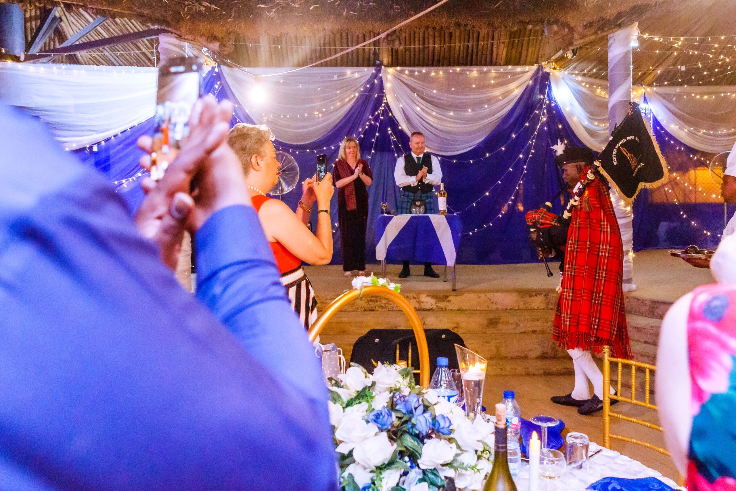 Guests listening to a traditional bagpipe performance