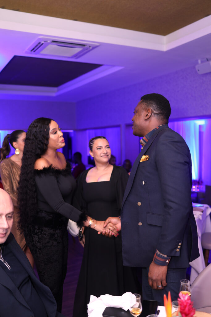 A photo of Haillie Sumney, actresses, chatting with Customer Marketing Manager, West & North Africa, Edrington, Abayomi Ajao (right) as Marketing Director, Raju Ghana, Jihane Thakulooks on 