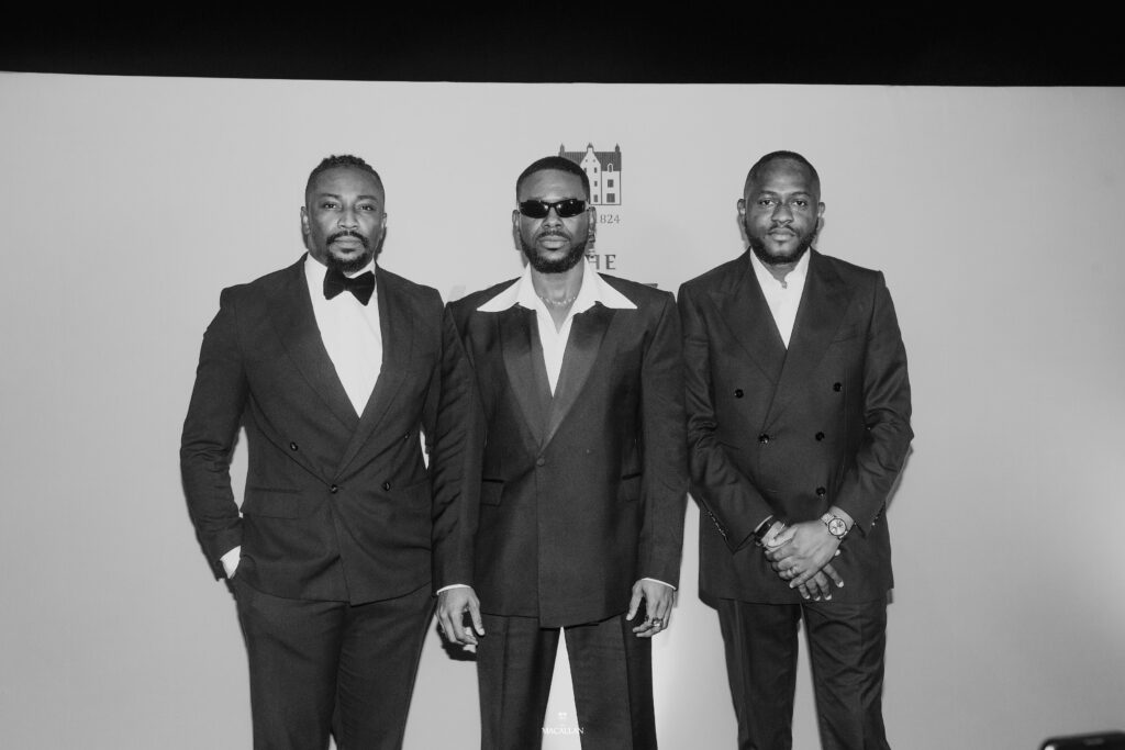 L-R: Daniel 'Sir Dee' Atteh, The Macallan ambassador, Lagos; Adekunle Gold and Hammed Adebiyi, Senior Brand Manager, Nigeria - Edrington Portfolio at an exclusive dinner event held in honour of Adekunle Gold in Lagos.